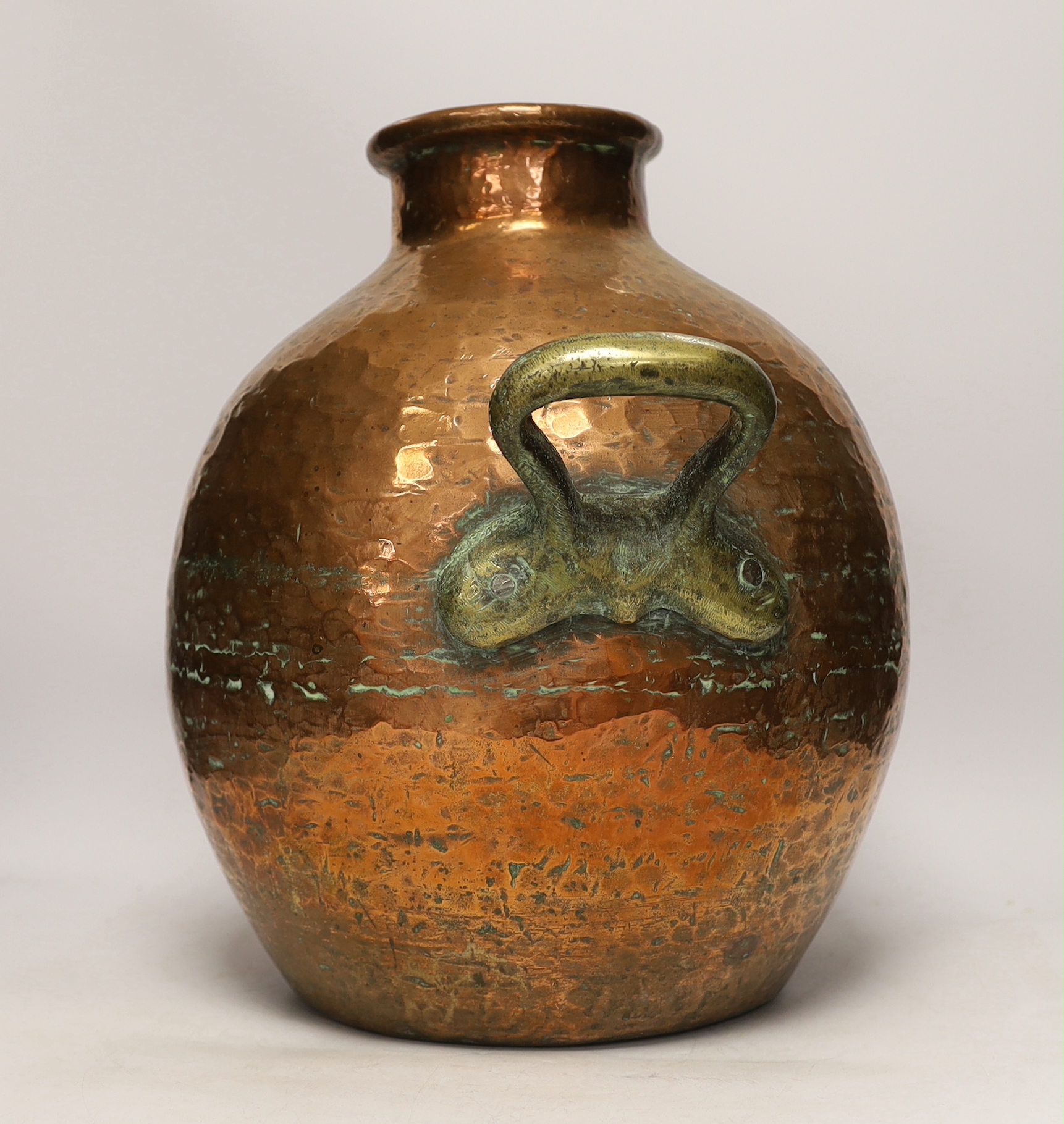 A copper vessel with double brass handles, 39cm high